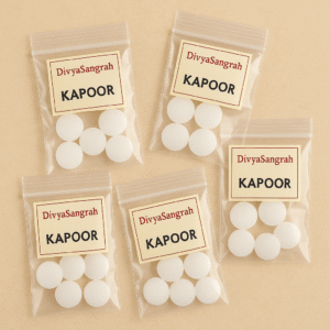 "Kapoor camphor tablets in small resealable plastic bags labeled 'DivyaSangrah' for pooja use, neatly packed on a beige background."
