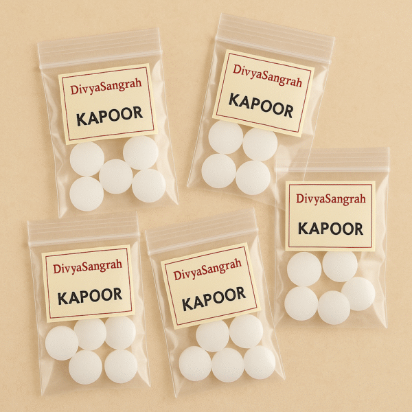 "Kapoor camphor tablets in small resealable plastic bags labeled 'DivyaSangrah' for pooja use, neatly packed on a beige background."