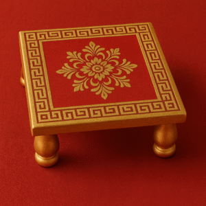 "Traditional wooden Pooja Chowki with golden floral design and carved legs, used as a Murti stand in Hindu rituals and home temples."