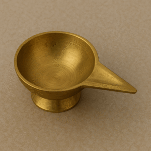 "Brass ghee batti holder diya used in Hindu pooja for lighting sacred lamp with cotton wick and ghee"